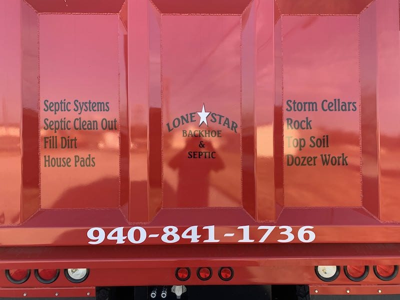 Lone Star truck tailgate listing septic and excavation services
